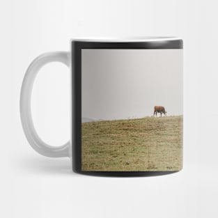 cows grazing a field Mug